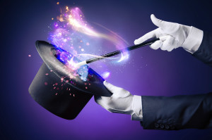 High contrast image of magician hand with magic wand